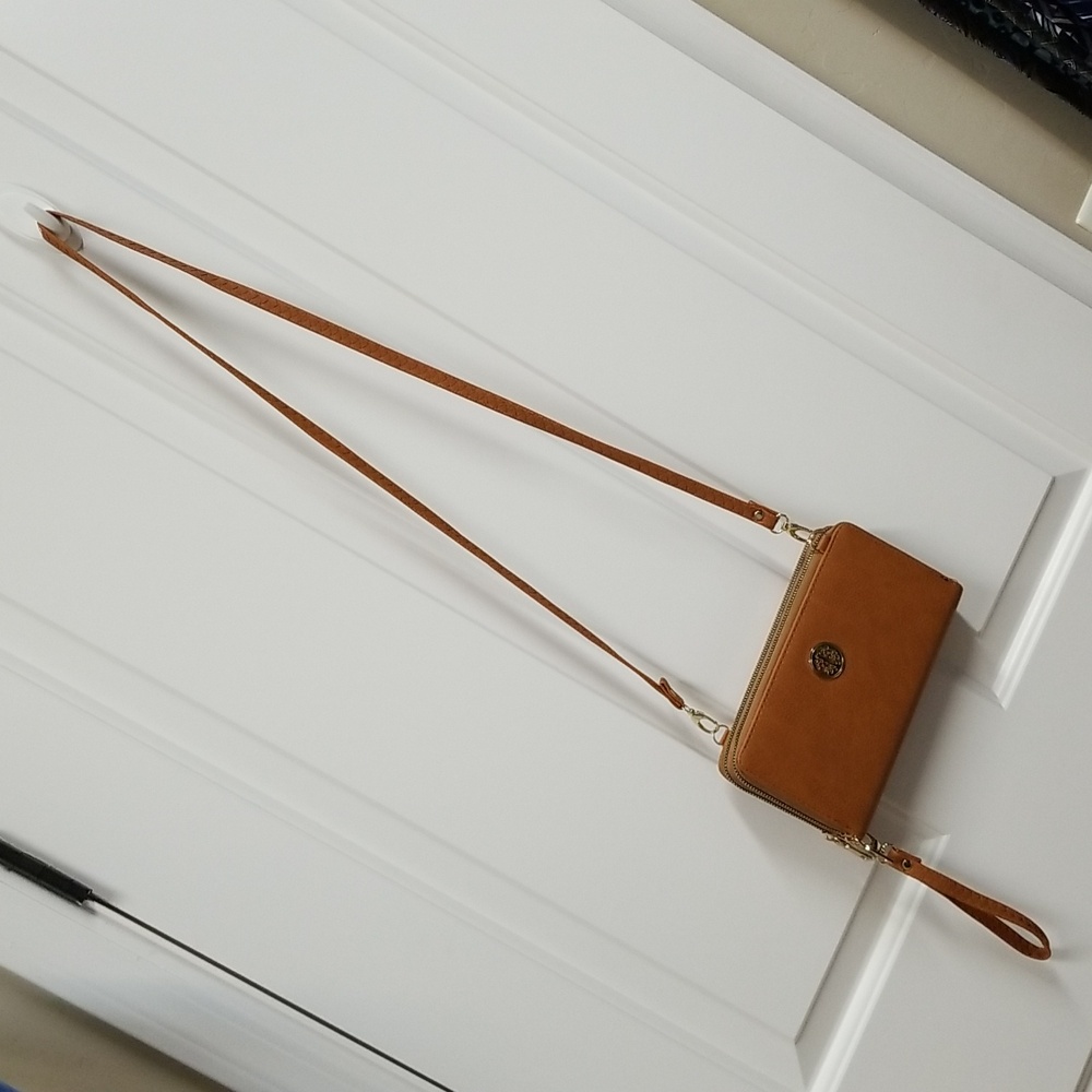 Medallion wristlet/crossbody bag